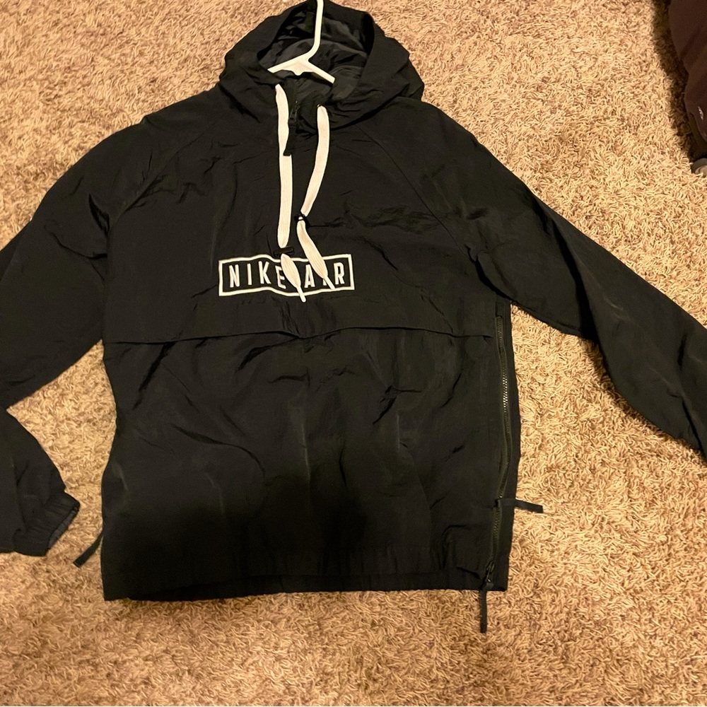 Medium black pullover Nike jacket. No flaws or stains.